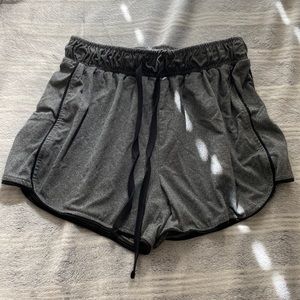 dark grey shorts with black lining and drawstring